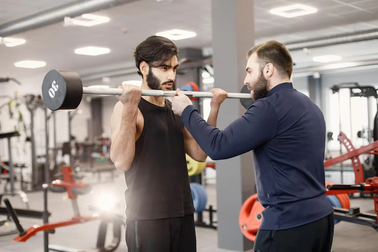 indian-man-doing-excercisses-special-equipment-gym-with-personal-trainer_1157-51767 (2)