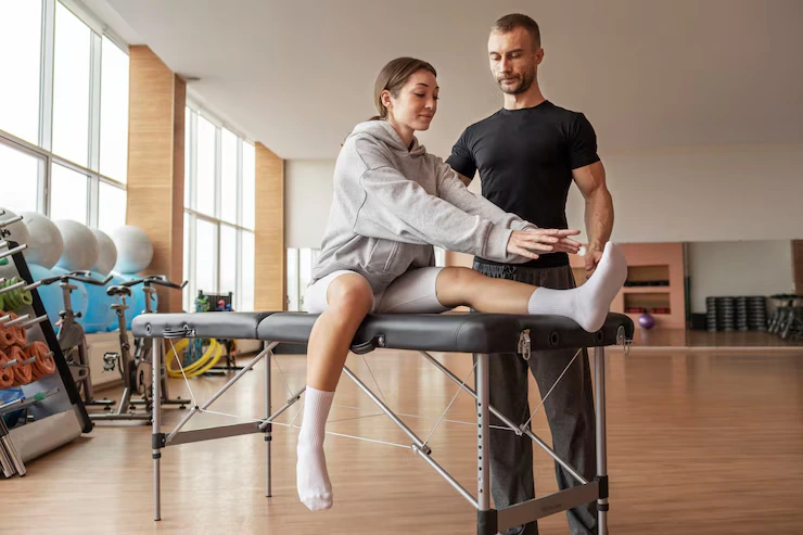 patient-doing-physical-rehabilitation-helped-by-therapists_23-2149227852